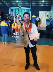 John Denver Alayon with his trophy and certificates. Photo from WITDio