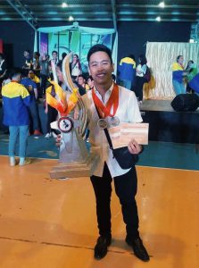 John Denver Alayon with his trophy and certificates. Photo from WITDio 